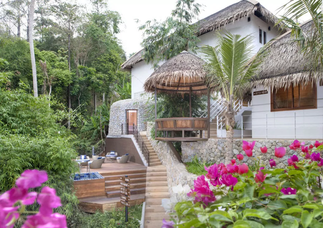 The Santosa buildings on the green hillside above Kata