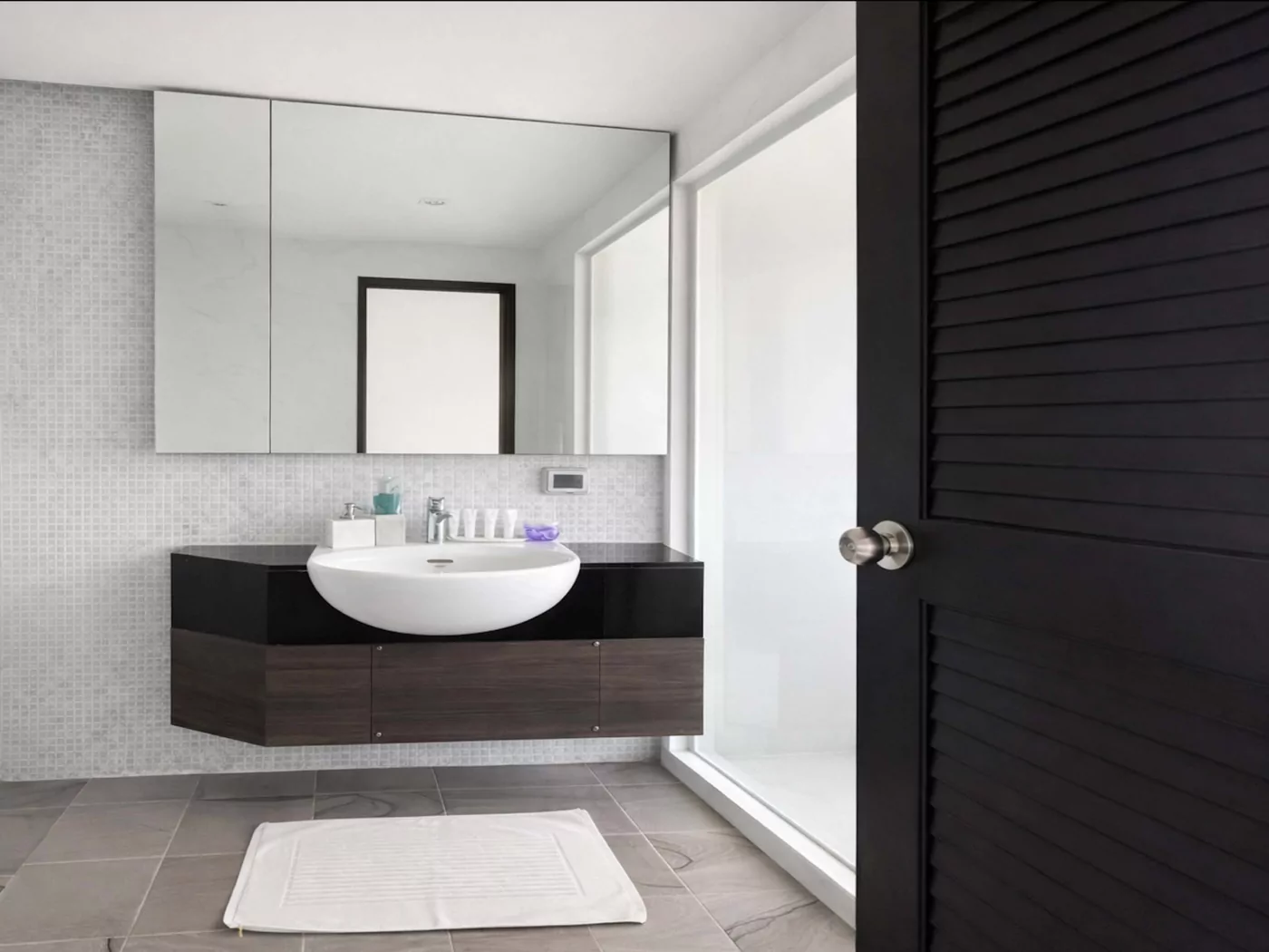 Bathroom with vanity and walk-in rain shower